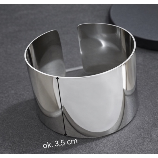 Minimalistyczny mankiet ze stali nierdzewnej w kolorze srebrnym – nowoczesna forma i ponadczasowa elegancja.