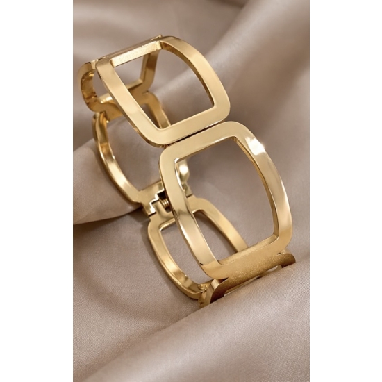 Geometryczny mankiet zaciskowy ze stali nierdzewnej w kolorze złotym – nowoczesny design i wygodny mechanizm.