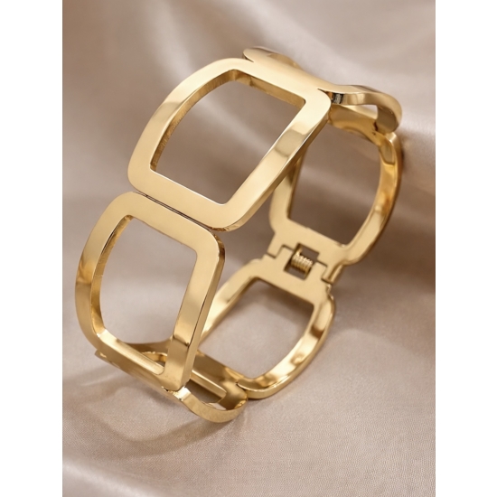 Geometryczny mankiet zaciskowy ze stali nierdzewnej w kolorze złotym – nowoczesny design i wygodny mechanizm.