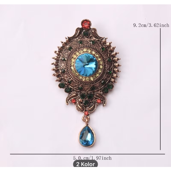 Broszka vintage – kolor, blask i charakter w jednym detalu.