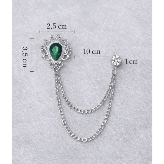 Podwójna broszka z zielonym szkłem – chłodna elegancja w kolorze srebrnym.